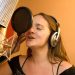 Ann recording vocals in the studio.